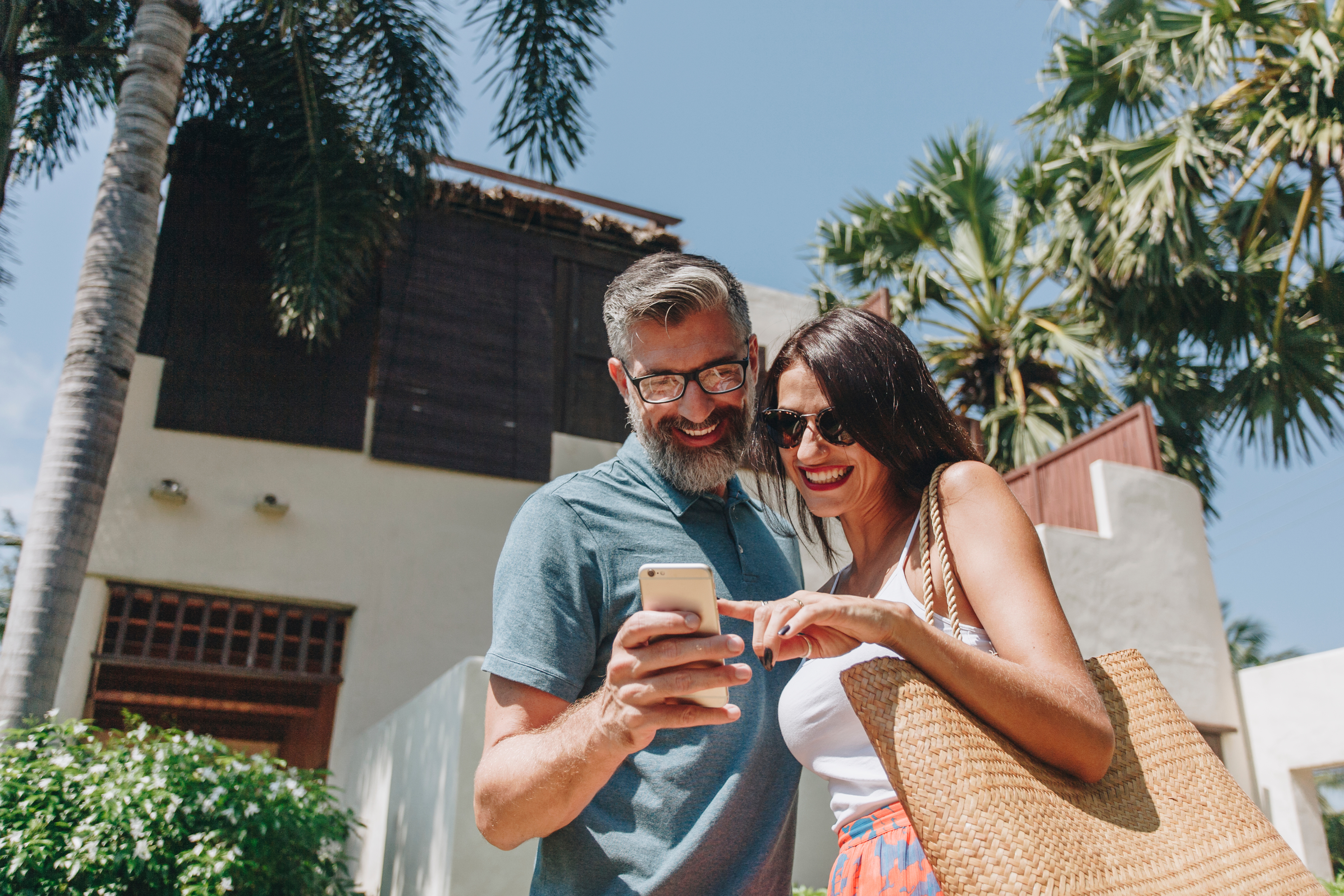 Couple looking at phone on vacation